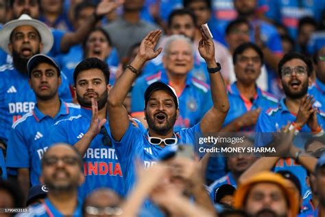 Indian cricket fans watch the 2023 ICC Men's Cricket World Cup... News ...