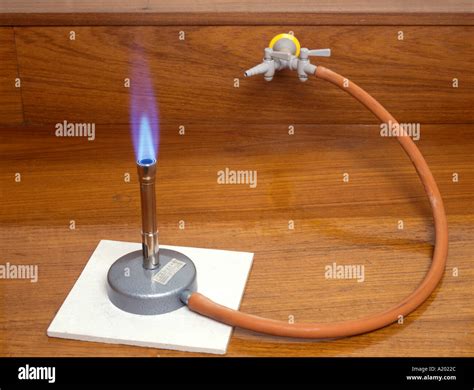 bunsen burner with a roaring blue flame when the air hole is open Stock ...