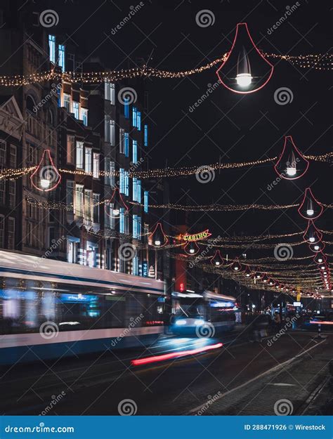 Vertical of Tram Driving on the Street of Damrak in Amsterdam ...