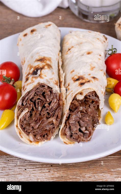 Wrap Doner Kebab. Meat doner kebab on wooden background. Traditional ...