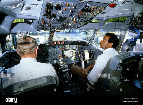 Pilot and co-pilot in the cockpit of a DC-10 commercial airplane Stock ...