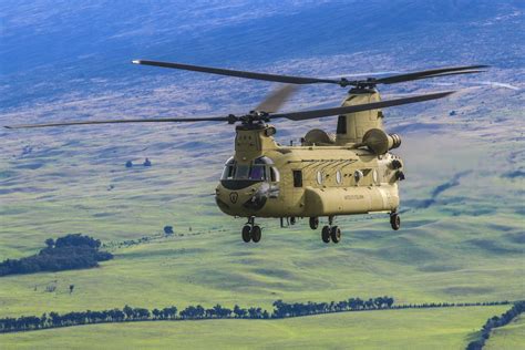 An Army Chinook helicopter provides troop lift support to soldiers at ...