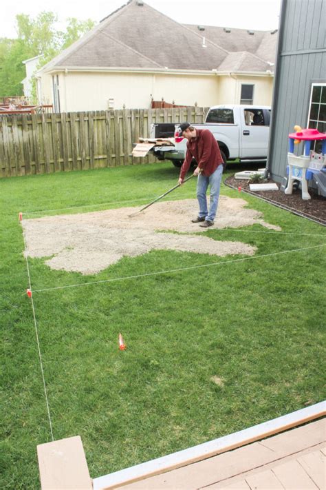 DIY patio with grass between pavers and a fire pit!