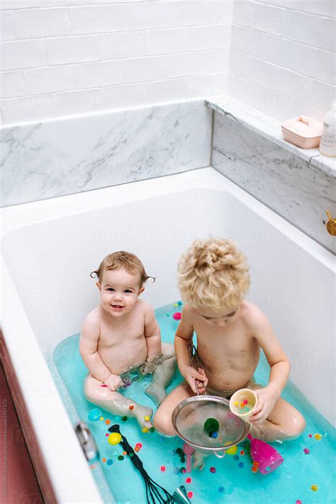 "Sensory Bath Time Play For A Baby Girl And Toddler Boy With Colorful ...