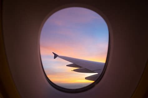 Premium Photo | Sunset sky from the airplane window