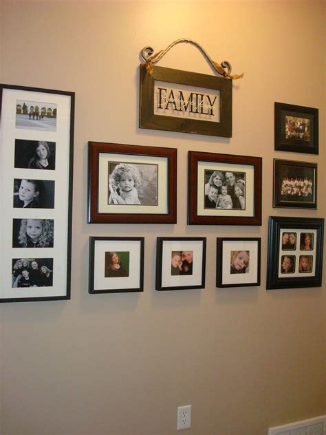 wall of pics | Photo arrangements on wall, Family photo wall ...