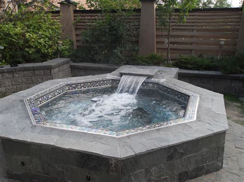 Classic Hanover stainless steel hot tub with custom tile and waterfall ...