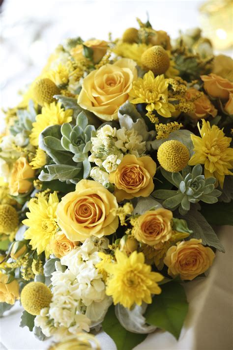 Yellow centerpieces with roses, billy balls, succulents, and other ...