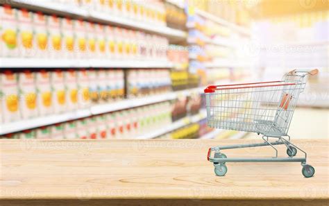 Supermarket with product shelves blur background with empty shopping ...