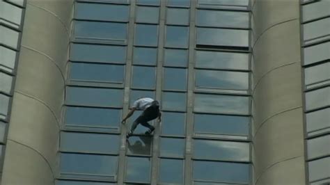 Man free solo-climbs 689-foot tower in solidarity with quake victims in ...