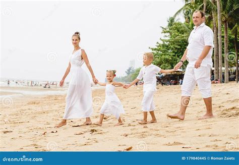 Happy Young Family on the Sunset at the Beach. Stock Image - Image of ...