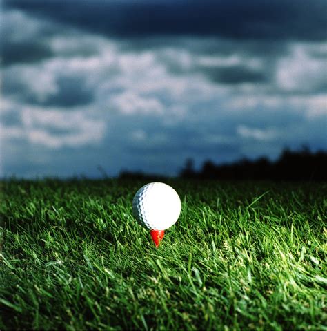 Golf Ball On Tee, Close-up, Ground View Photograph by Daniel Allan