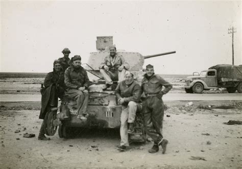 United States servicemen pose with an Italian tank in North Africa ...