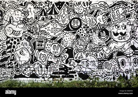 Cartoon graffiti in black and white on a Bristol railway bridge UK ...