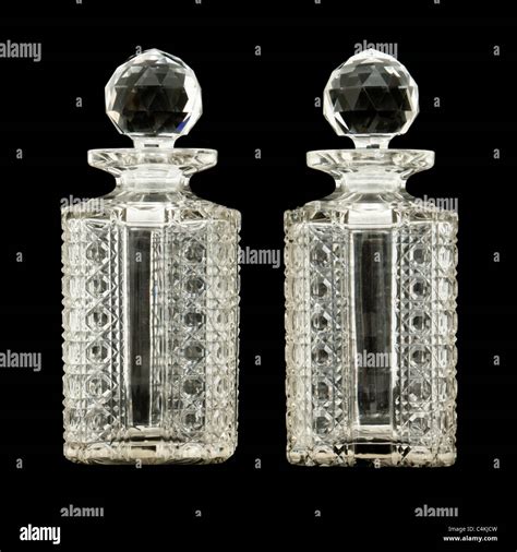 Pair of antique crystal / cut glass whiskey decanters Stock Photo - Alamy