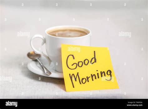 Cup of coffee with note good morning Stock Photo - Alamy