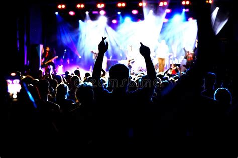 Happy Crowd with Raised Hands at a Rock Concert. Stock Photo - Image of ...