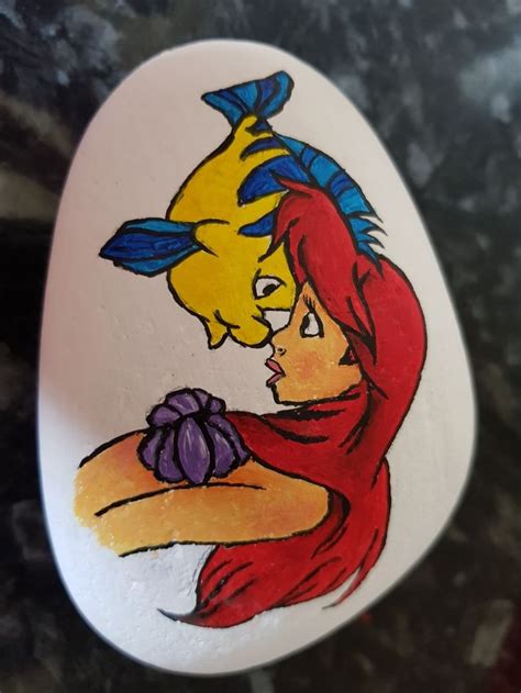 Ariel and flounder hand painted rock | Hand painted rocks, Painted ...