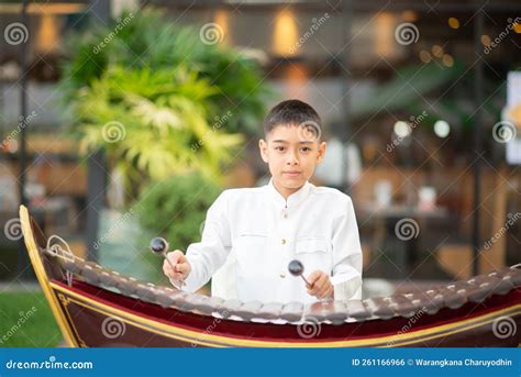 Asian Boy Play The Ranat Ek Thai Musical Xylophone Instrument In The ...