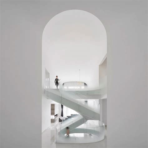 Grand spiral staircase dominates Cloud Villa in Shanghai by KOS Architects