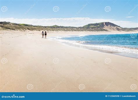 Two Female Walkers at the Beach of Peterborough at the Great Ocean Road ...