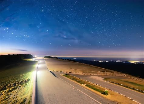 Premium AI Image | Night sky road and starry sky panorama from Mont ...