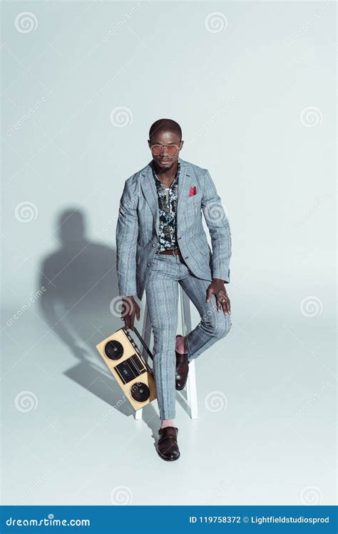 Handsome African American Man in a Suit and Sunglasses, Sitting on a Bar Stool Stock Photo ...