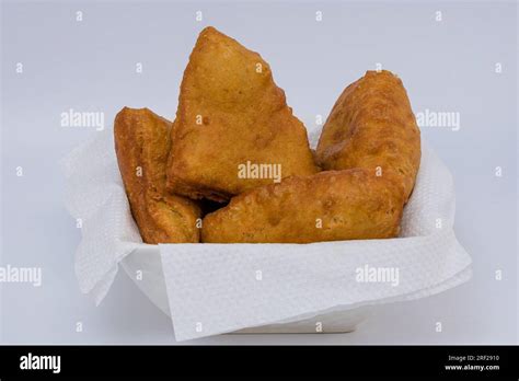 Chapati Mandazi Andazi Samosa triangular-shaped snacks on a plate on a ...