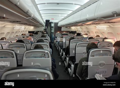 a general view of interior on board inside a commercial aeroplane cabin ...