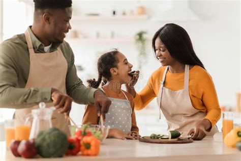 African Family Cooking Together Having Fun Making Salad in Kitchen ...