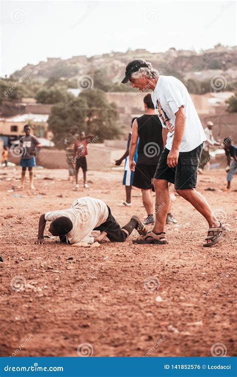 Black African Children Playing Soccer with Caucasian Volunteer ...