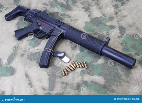 Submachine Gun MP5 with Silencer on Camouflaged Stock Image - Image of ...