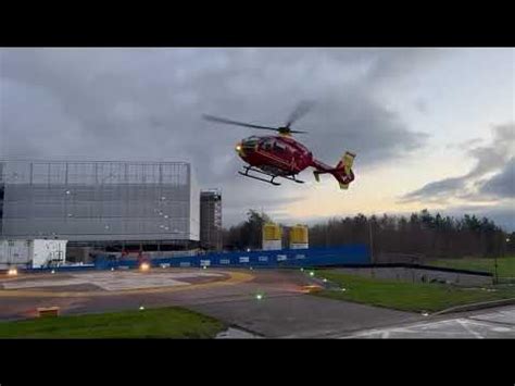 Air ambulance landing Royal Stoke Hospital - YouTube