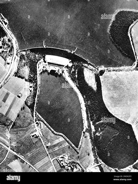 Aerial photograph showing the Mohne Dam and reservoir (top) before the ...