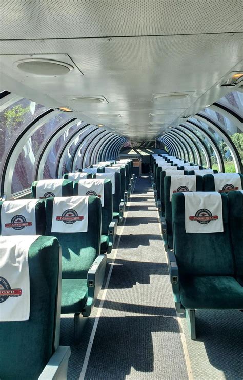 the inside of an airplane with green seats