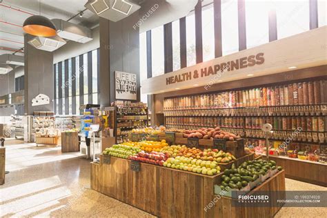 Produce and bulk food on display in health food grocery store market ...