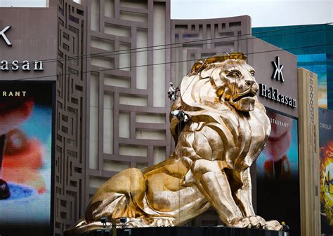 Workers buff the MGM lion statue outside the MGM Grand on Tuesday ...