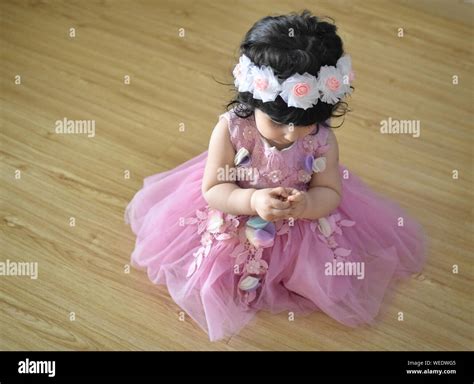 Cute baby girl in pink princess dress Stock Photo - Alamy