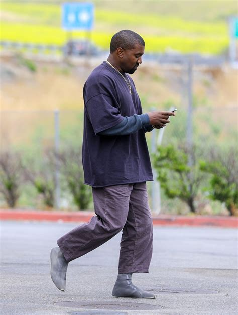 Kanye West Wearing a Sock Shoe | Vogue