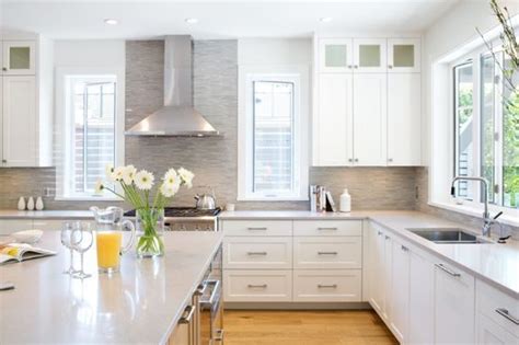 Caesarstone Clamshell countertops in this all-white kitchen design with ...