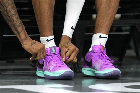 Memphis Grizzlies guard Ja Morant (12) ties his shoe before the game ...