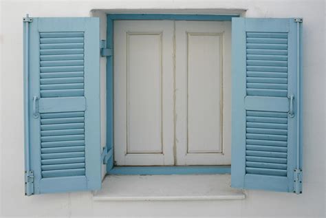 Window with blue shutters 1987485 Stock Photo at Vecteezy