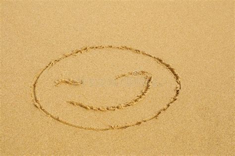 A smiley emoji on the sand stock photo. Image of sand - 257573718