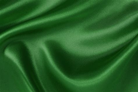 Dark green fabric texture background, crumpled pattern of silk or linen ...