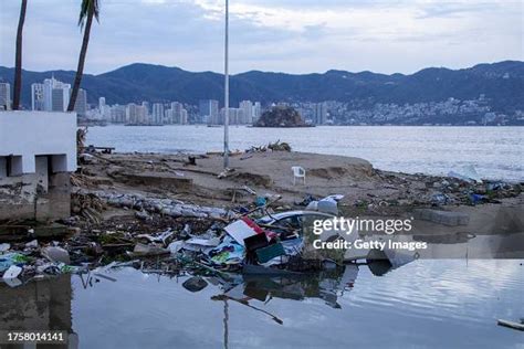 A car is seen sunk after hurricane Otis hit Acapulco on October 25 ...