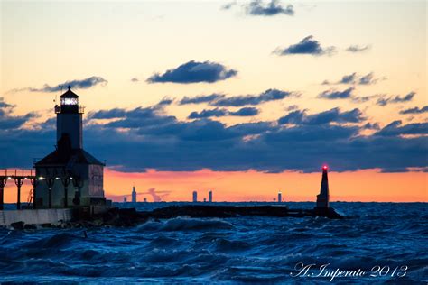 Michigan city lighthouse with Chicago skyline in background