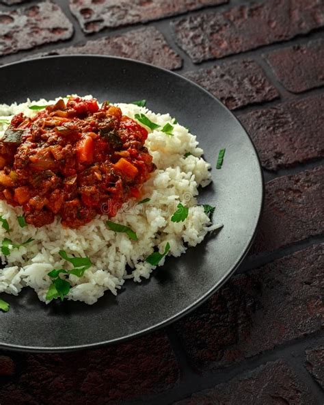 Homemade Beef Mince and Vegetable Casserole Served with Rice on Black ...