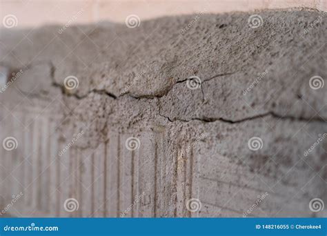 Old Foundation and Plaster Wall with Cracks. Building Requiring Repair ...