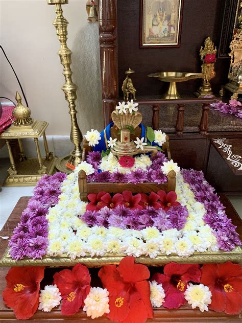 an elaborately decorated cake with flowers on the table in front of ...