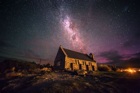 The Milky Way stretching across the sky over a little church at Lake ...